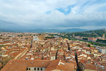 Naklejka premium Top panoramic cityscape view of medieval city Florence, capital of Tuscany region, plenty of roof top renaissance architectures and riverside of Arno river in Florence, Italy