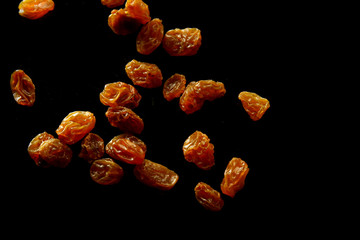 Raisins background / A raisin is a dried grape. Raisins are produced in many regions of the world and may be eaten raw or used in cooking, baking, and brewing.