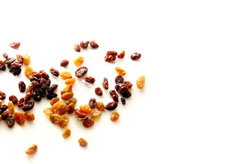 Raisins background / A raisin is a dried grape. Raisins are produced in many regions of the world and may be eaten raw or used in cooking, baking, and brewing.
