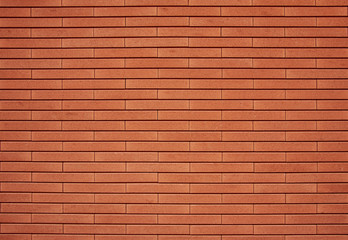Empty red brick wall textured background.