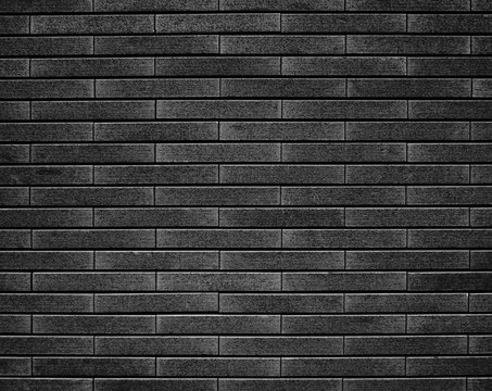 Empty gray brick wall textured background.