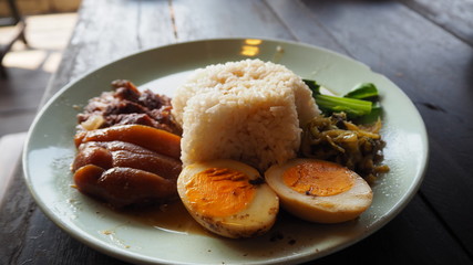 Stewed pork leg on rice. Thai food.