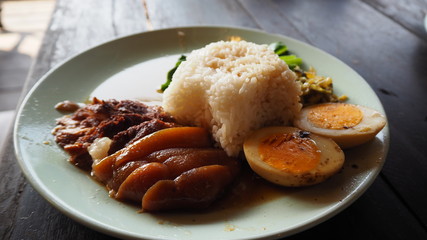 Stewed pork leg on rice. Thai food.