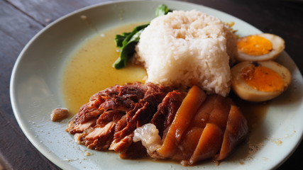 Stewed pork leg on rice. Thai food.