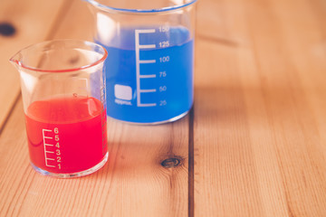 Glass measuring beaker in Laboratory, Science experiment concept