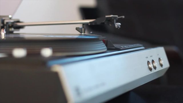 Good old automatic direct drive starts turning, while needle slowly sinks down touching the vinyl gently.