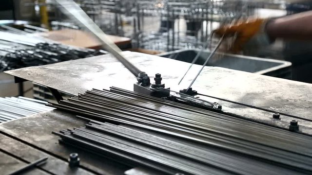 Worker Bending Iron Steel Metal in Factory