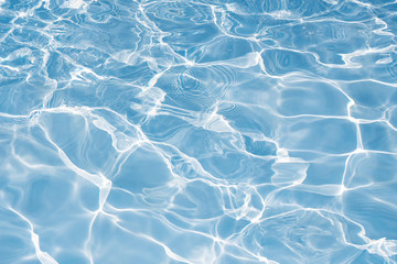 Texture of water in swimming pool for background