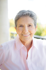 Fototapeta na wymiar Portrait of a mature elderly woman smiling.