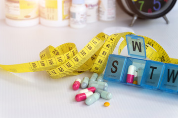 Slimming concept; Slim with pills, dangerous for health.