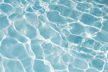 Texture of water in swimming pool for background