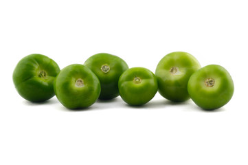 big and white green tomatoes in line