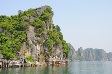 Fototapeta na wymiar Seven wonders - Famous Seascape of Ha Long Bay in Vietnam: Thousands of Limestone Karsts and Isles