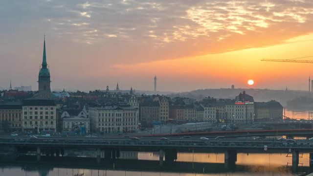 Stockholm Sweden time lapse 4K, city skyline night to day sunrise timelapse at Gamla Stan and Slussen