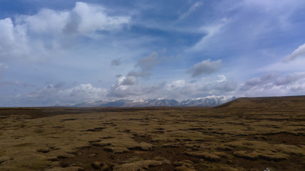Snow Mountain in the Distance and a Large Area of Grassland