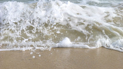 The wave flapped the coast and stirred layers of Spray