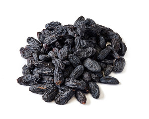Heap of black raisins isolated on white background.
