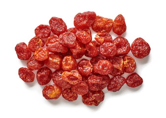 Heap of dried cherry tomatoes isolated on white background. Top view.