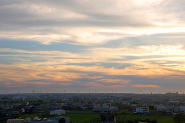 Wind turbines at sunset at a beach in Changhua, Taiwan