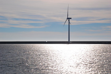 Wind turbines at sunset at a beach in Changhua, Taiwan