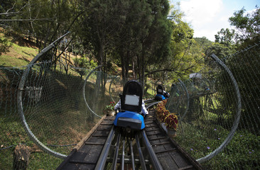 Rail downhill on a trolley to the Datanla waterfall in Vietnam