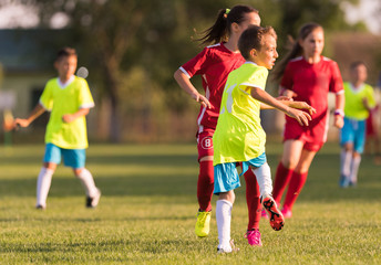 Young children players football match on soccer field