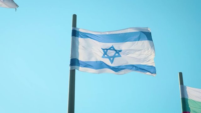 Realistic Israel flag waving in the wind.