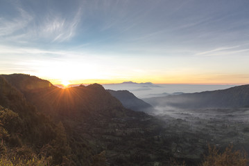 Fototapeta na wymiar Sunrise at Mount Bromo, is an active volcano and part of the Tengger massif, in East Java, Indonesia