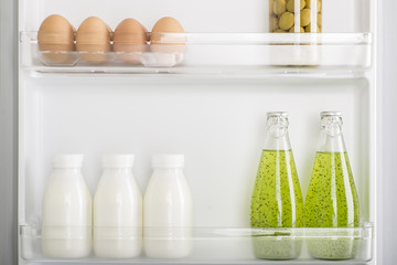 Open fridge full of fresh fruits and vegetables