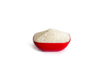 Uncooked rice in a bowl isolated on white background