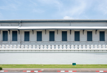 Architecture wooden building with windows on traditional white wall