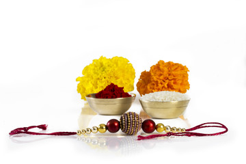 Raksha bandhan raakhi close up with gifts and sweets