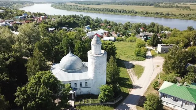 Aerial view of city landscape of Kasimov on Oka river with oldest Khan mosque, Russia