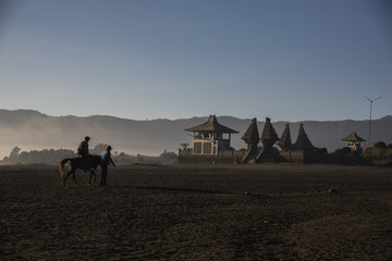 Silhouette of people and Horseman at the mountainside of Mount Bromo, Semeru, Tengger National Park, Indonesia.