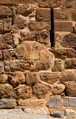 Fototapeta premium A fragment of the old stone masonry close-up.