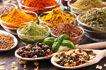 Variety of spices and herbs on kitchen table