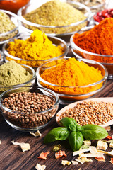 Variety of spices and herbs on kitchen table