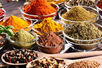 Variety of spices and herbs on kitchen table