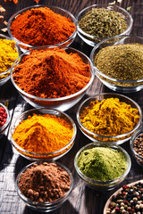 Variety of spices and herbs on kitchen table