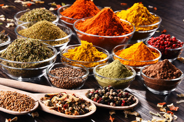 Variety of spices and herbs on kitchen table