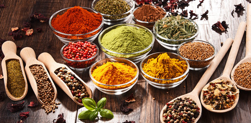 Variety of spices and herbs on kitchen table