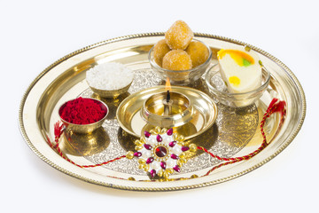 Raksha Bandhan rakhi with sweets diya and gift