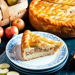 Apple pie on a blue background, sweet pastries, home cooking, piece, square
