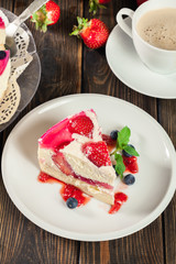 Cheesecake with strawberries, blueberry and jelly