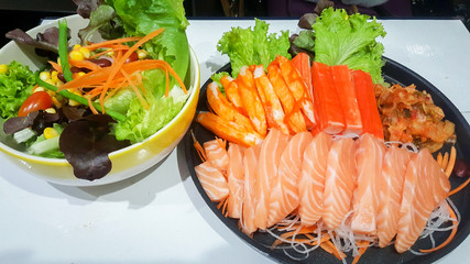 japanese food set raw fish with salads on table wood