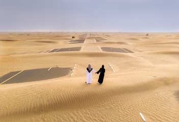 emirati couple in a desert