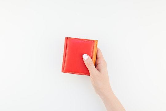 Woman Hand With Red Wallet Isolated