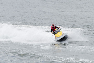 young man on a water motorcycle