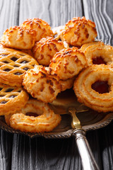 beautiful biscuit cookie rocher coco, couque and marimbas on a platter on a table. vertical