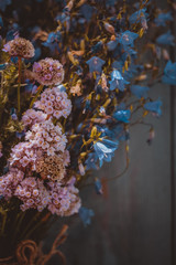 bouquet of blue wildflowers on a dark background 